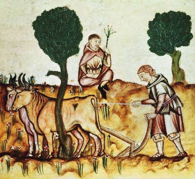 An historical illustration, depicting a Medieval peasant ploughing a field with cattle, while another man, possibly his lord, observes..