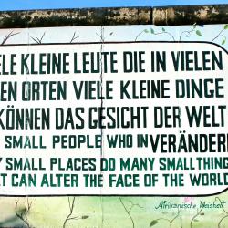 A graffiti wall in Germany encouraging climate action, and tying it to social and economic transformation, by emphasising many small changes.
