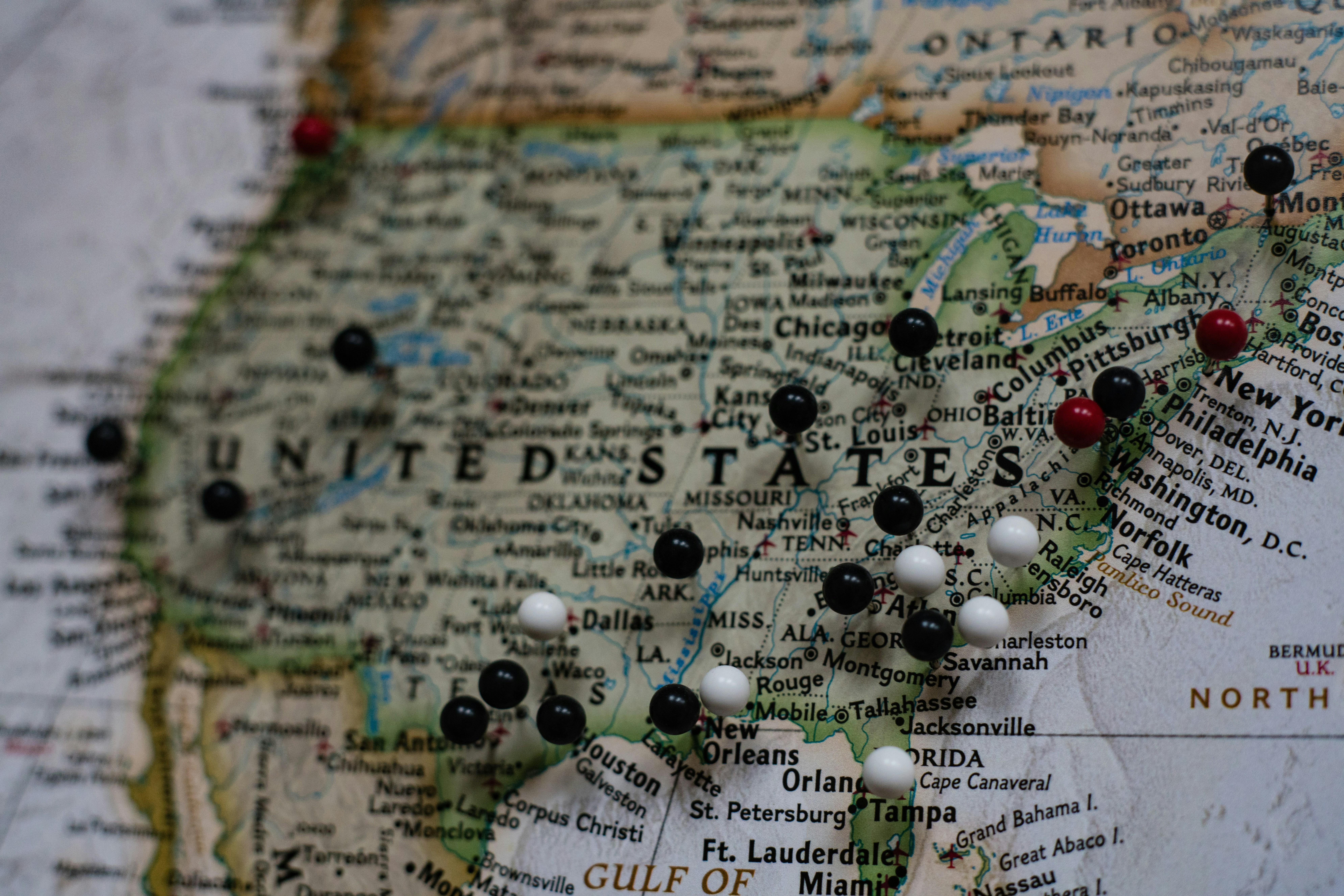 Map of the United States. Photo by Joey Csunyo on Unsplash. Map of the United States with map pins on different cities.