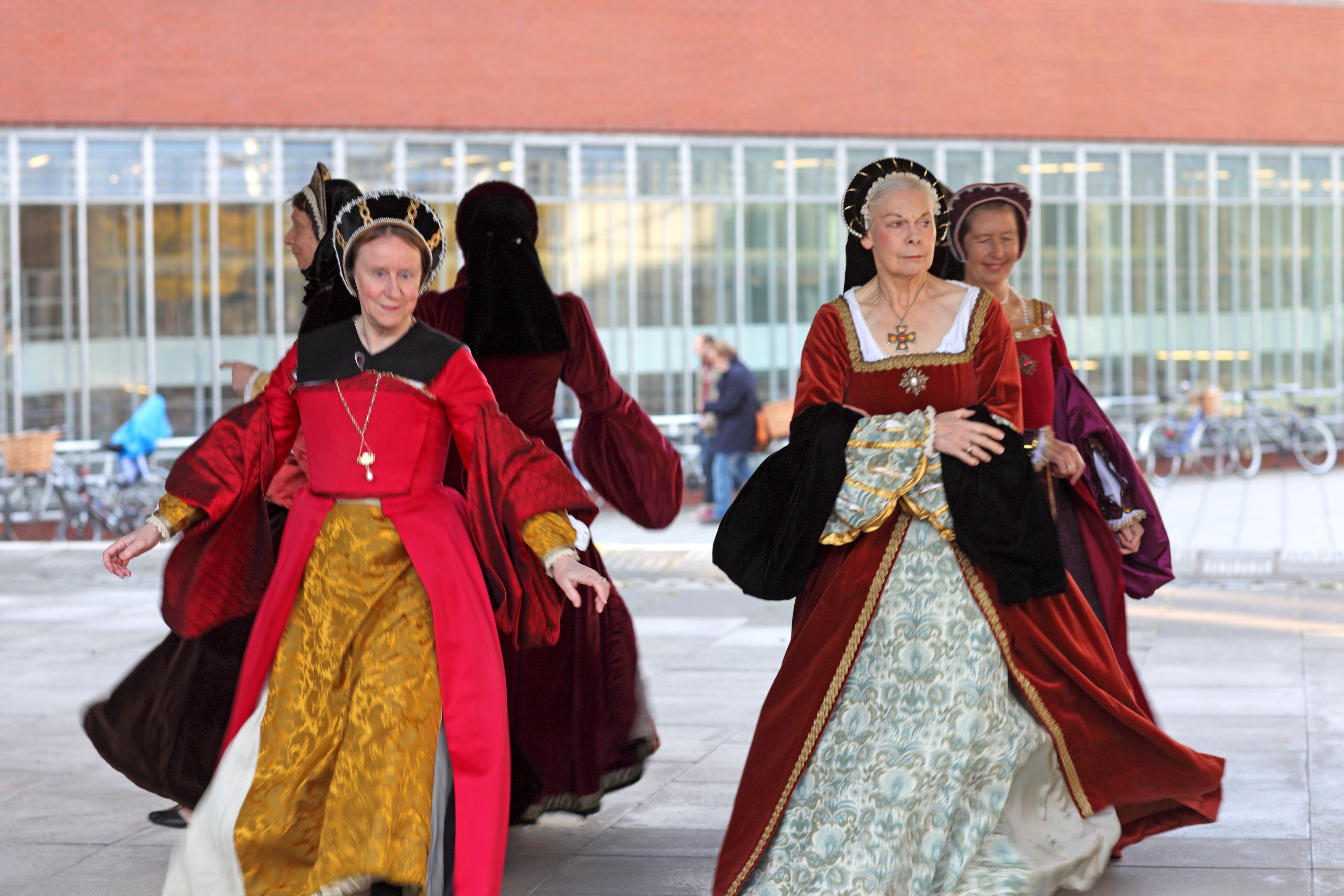 A demonstration of past legacies, with four actresses in Medieval clothing performing the roles of women in that time.