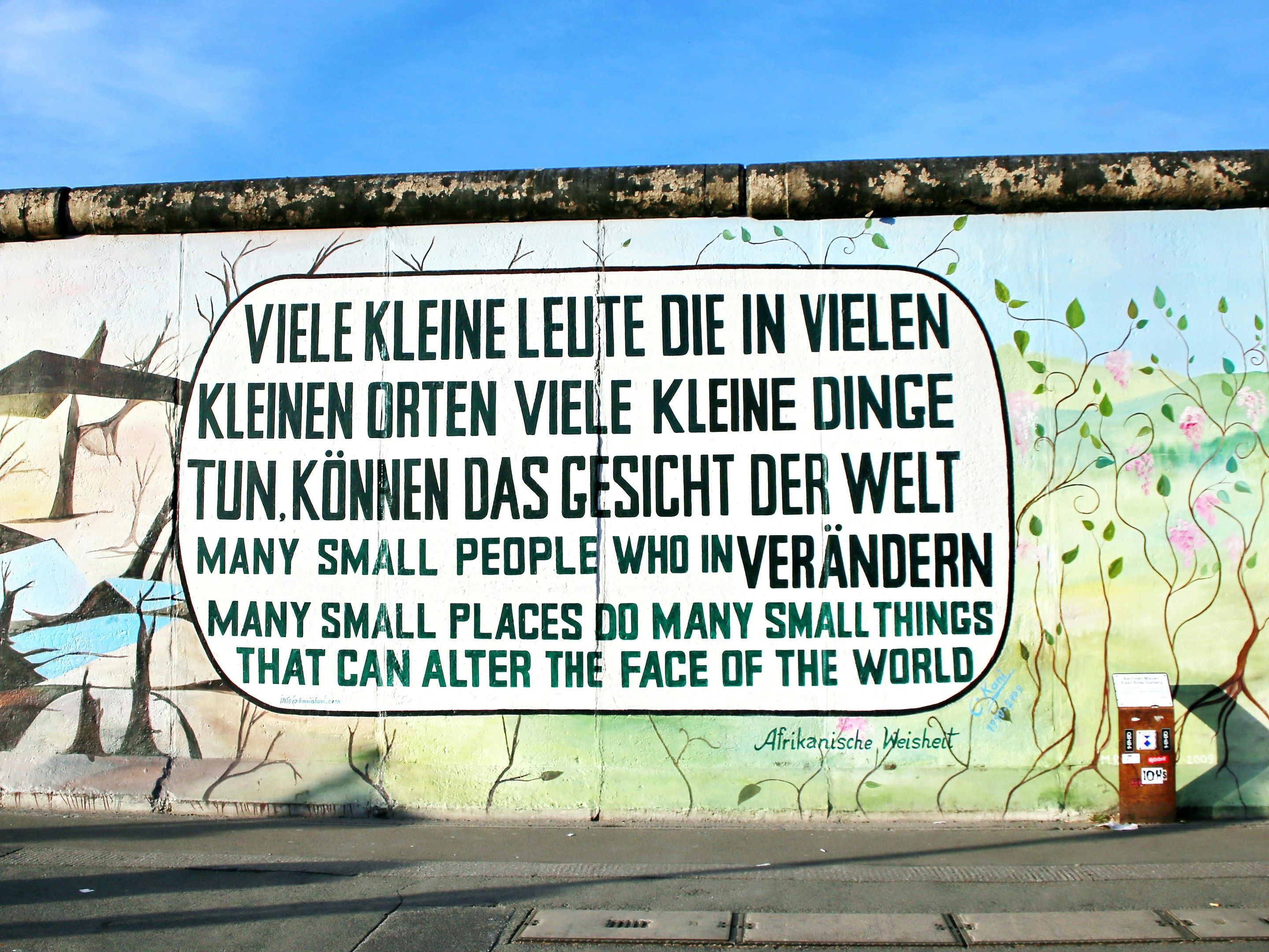 A graffiti wall in Germany encouraging climate action, and tying it to social and economic transformation, by emphasising many small changes.
